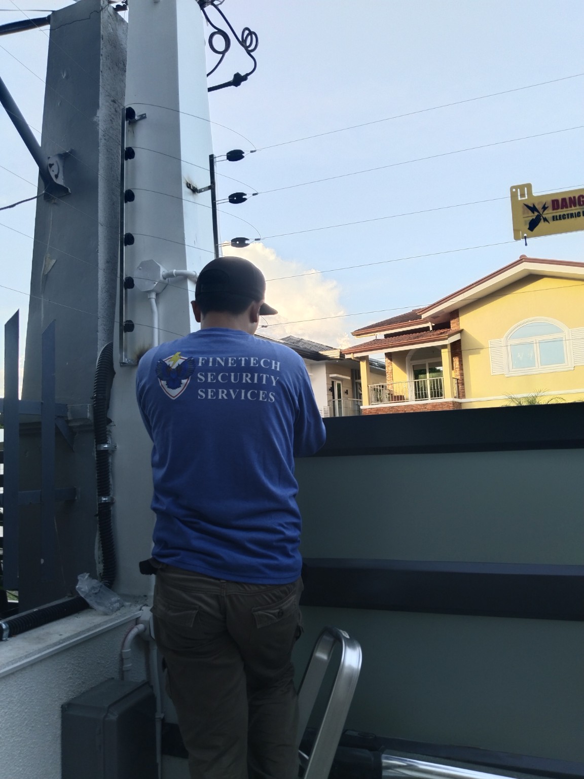 Finetech technician working on an electric fence